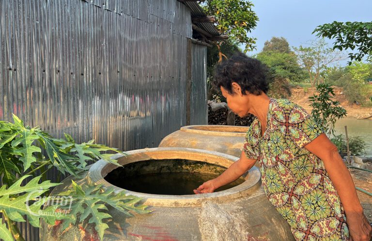 A resident of Bak Rotes village in Battambang province uses water taken from Sangke River on March 12, 2023. (CamboJA/ Sovann Sreypich)