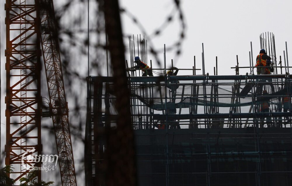 Laborers work at a construction site in Phnom Penh on March 13, 2023. (CamboJA/ Pring Samrang)