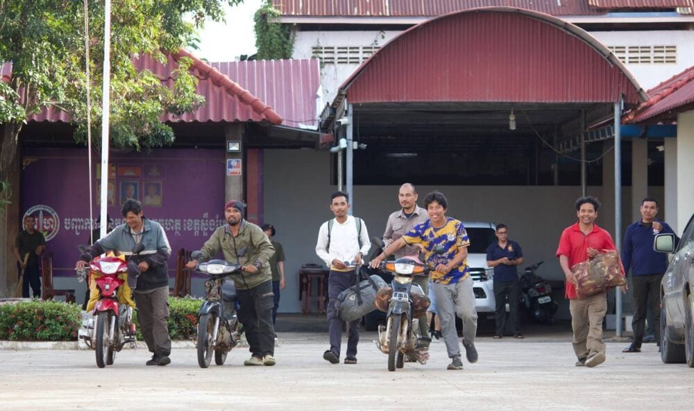 Six environmental activists push their motorbikes out of the Stung Treng military police headquarters after their release on November 25, 2024. (Ma Chettra).