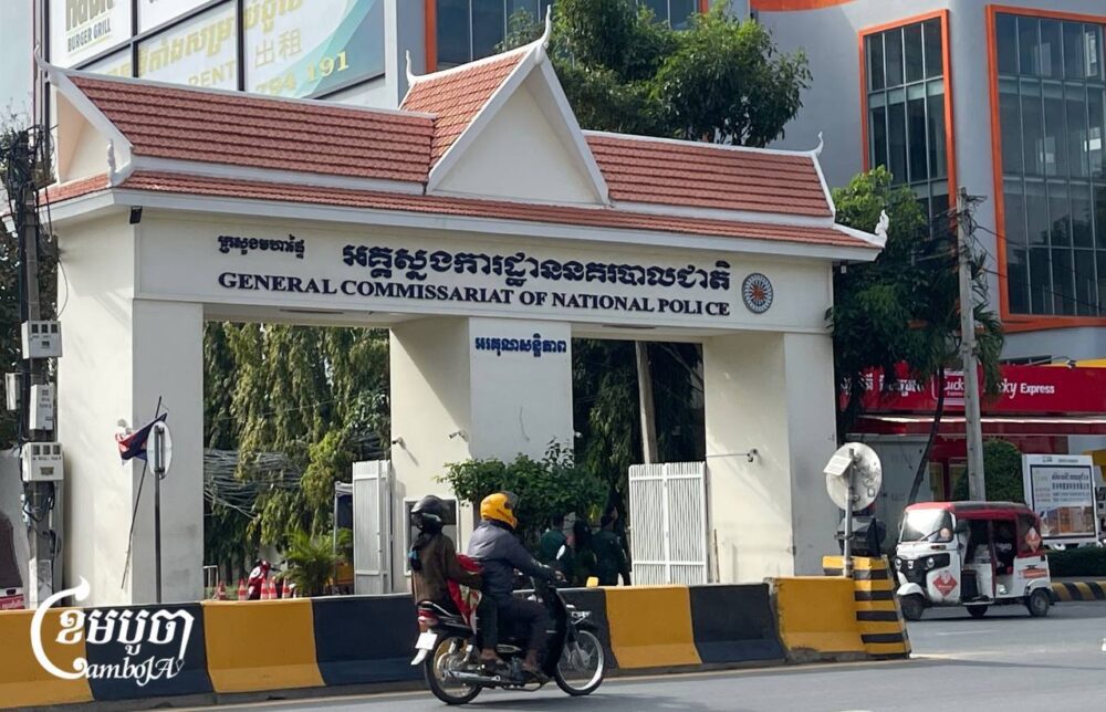 Motorists drive past the General Commissariat Of National Police in Phnom Penh on January 2, 2025. (CamboJA/ Pring Samrang)