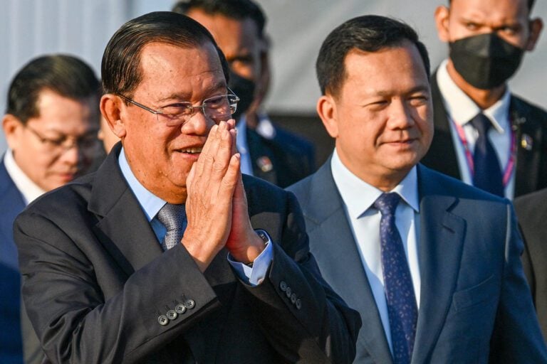 Cambodia's Senate President Hun Sen (L) and Cambodia's Prime Minister Hun Manet (R) walk during a ceremony marking the 46th anniversary of the fall of the Khmer Rouge regime in Phnom Penh on January 7, 2025. (Photo:AFP)