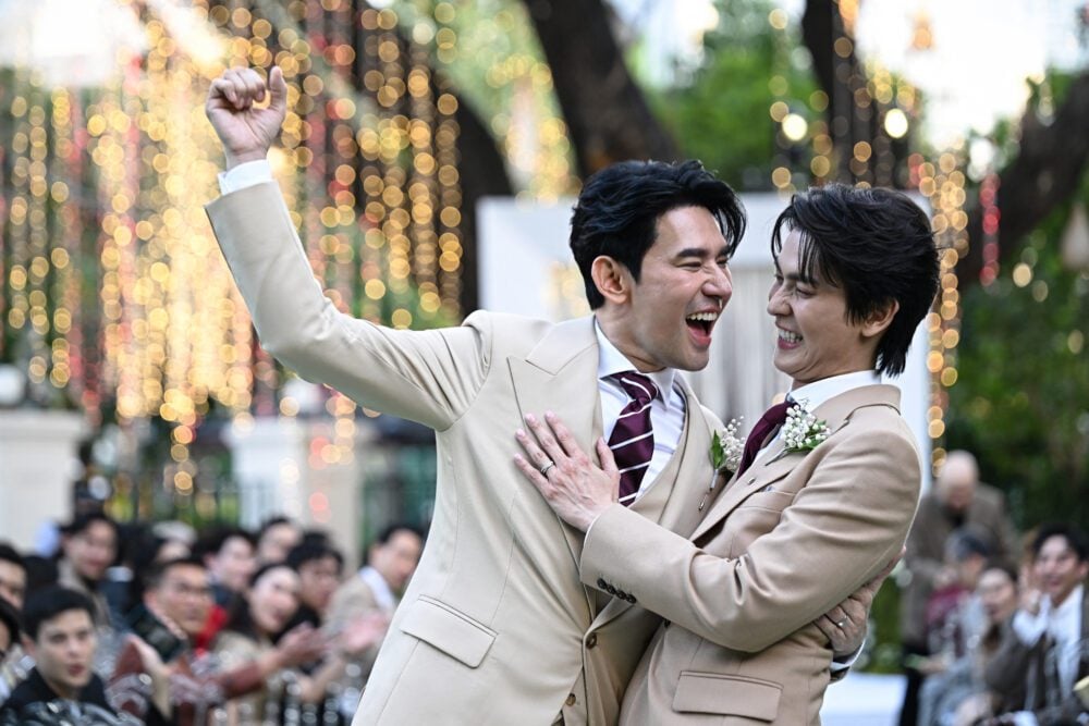This photo taken on January 10, 2025 shows Apiwat "Porsch" Apiwatsayree (L) and Sappanyoo "Arm" Panatkool posing for photos at their unofficial wedding ceremony in Bangkok. Hundreds of LGBTQ+ couples are set to marry in Thailand on January 23, as the country makes history by becoming the first country in Southeast Asia to legalise same sex marriage. (Photo:AFP)