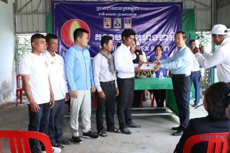 Phan Sarath and fellow party members receive an appointment letter from Rong Chhun (standing, third from right), senior advisor to Nation Power Party. A photo posted on NPP’s Facebook.