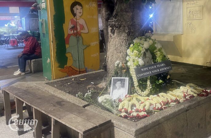 Wreaths and garlands are placed beside a portrait of former opposition lawmaker Lim Kimya near Wat Bowonniwet Vihara in Bangkok, where he was shot dead on Jan. 7, 2025. Photo taken Jan. 16, 2025. (CamboJA/Khuon Narim)