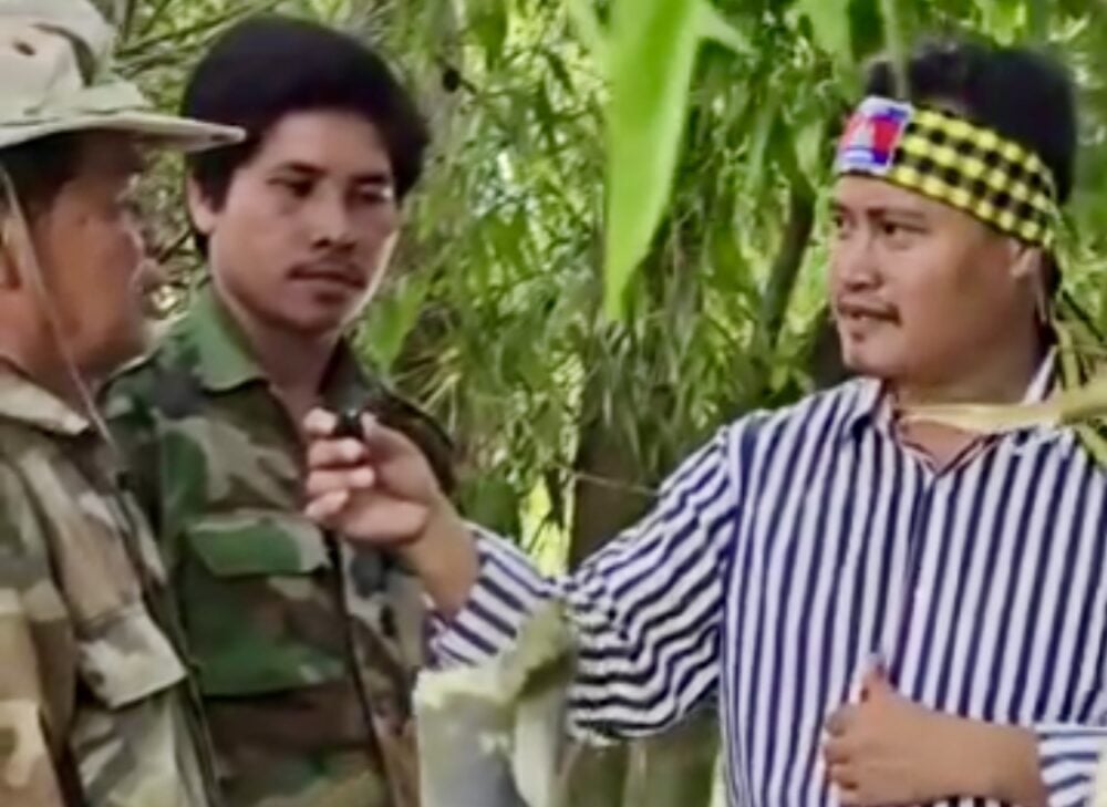 A screenshot photo of publisher Hang Samang and two other men in military uniform during the video interview.