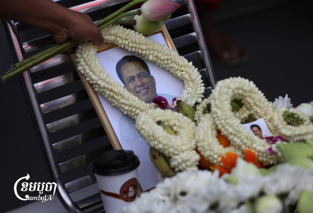 Civil society groups and youth activists lay wreaths at a gas station where activist Kem Ley was shot and killed in 2016, marking the ninth anniversary of his death. July 10, 2025. (CamboJA/ Pring Samrang)