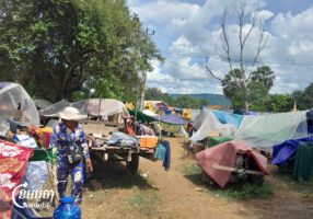 A woman walks near the camp shelter at Wat Oddarkiri Tuol Andet Safe Center in Thnal Baek Village in Thmei Commune, Kulen District on August 5, 2025. (CamboJA/Va Sopheanut)