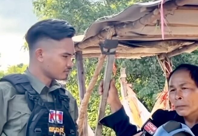 A screenshot of a video showing NCC Daily reporter Meas Sara interviewing a villager along the border on August 20, 2025.