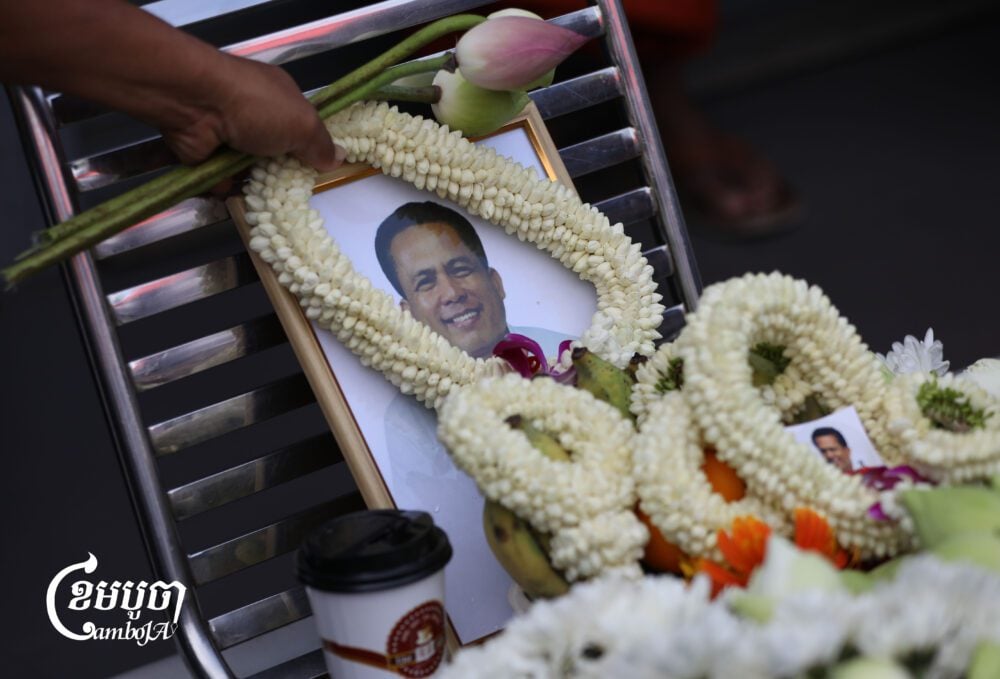 Civil society groups and youth activists pay their respect at a gas station in Phnom Penh where activist Kem Ley was shot and killed in 2016, marking the ninth anniversary of his death. July 10, 2025. (CamboJA/ Pring Samrang)