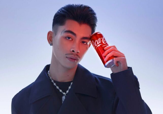 Cambodian rapper Mann Vannda, a Coca-Cola brand ambassador, holds a can of the soft drink in a photo posted on his page on July 15, 2025.