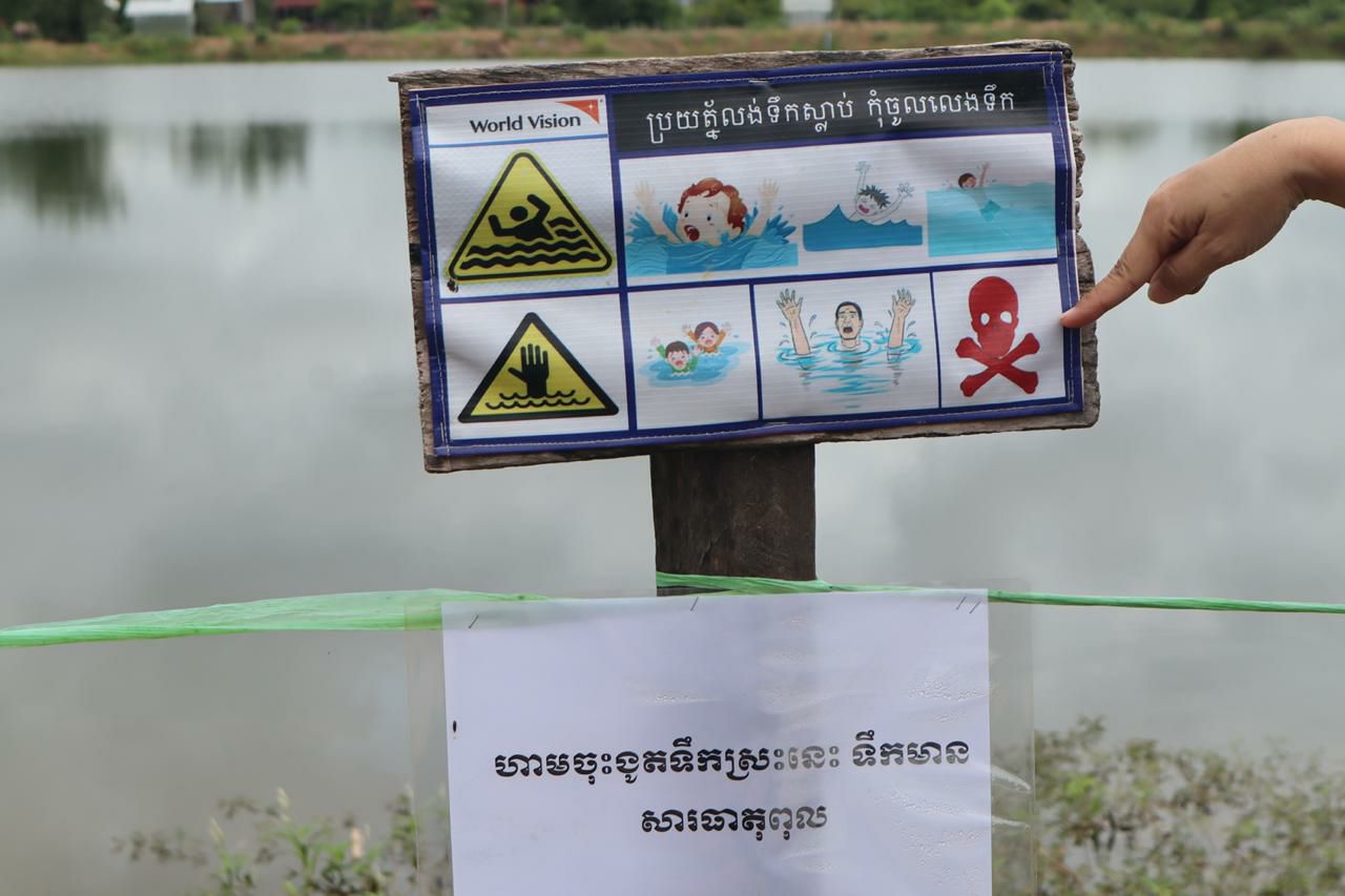 A prohibition sign in Choam Ksan district, Preah Vihear province, warns people not to swim in the lake as it might be contaminated. Taken on September 6. Photo credit: Cambodian Human Rights Action Coalition (CHRAC).