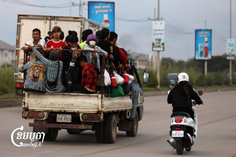 A truck transports garment workers to a factory on the outskirts of Phnom Penh. Sept. 3, 2025. (CamboJA/ Pring Samrang)