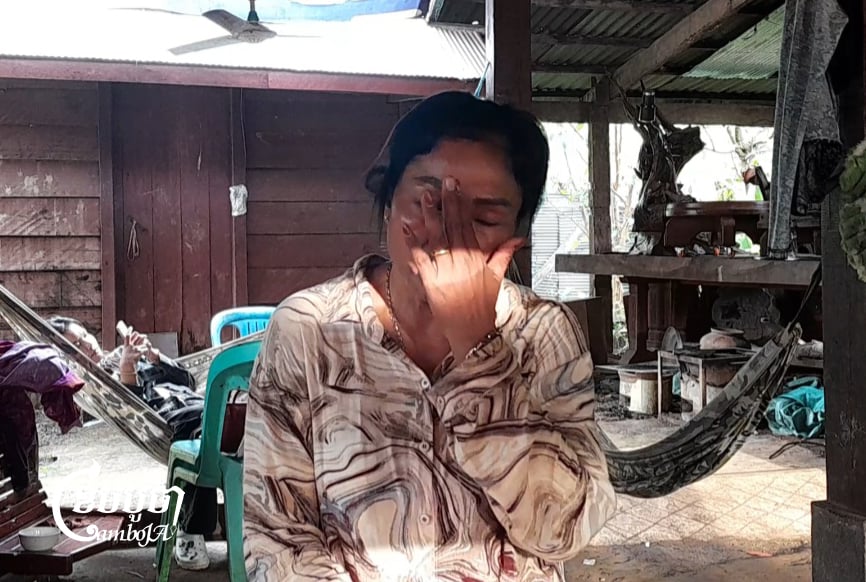 Kin Sok Khim, the wife of Captain Bun Tha, crying on a chair during an interview in her house in Preah Vihear city, on 06 September 2025. (CamboJA News/Va Sopheanut)