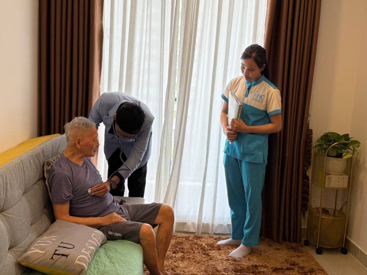 A MUCH doctor (center) makes a house call to check an elderly, accompanied by a nurse who is on standby 24/7. (Supplied)