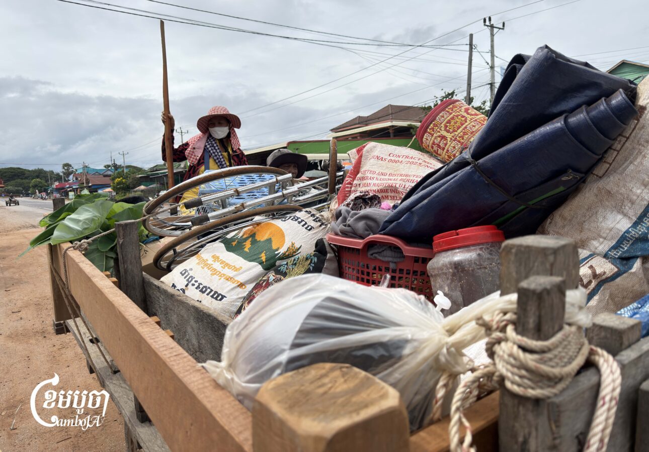 Seng Hat and his family on a tractor to Chheu Teal Kong village, which is close toThai border on October 30, 2025. (CamboJA/Va Sopheanut)