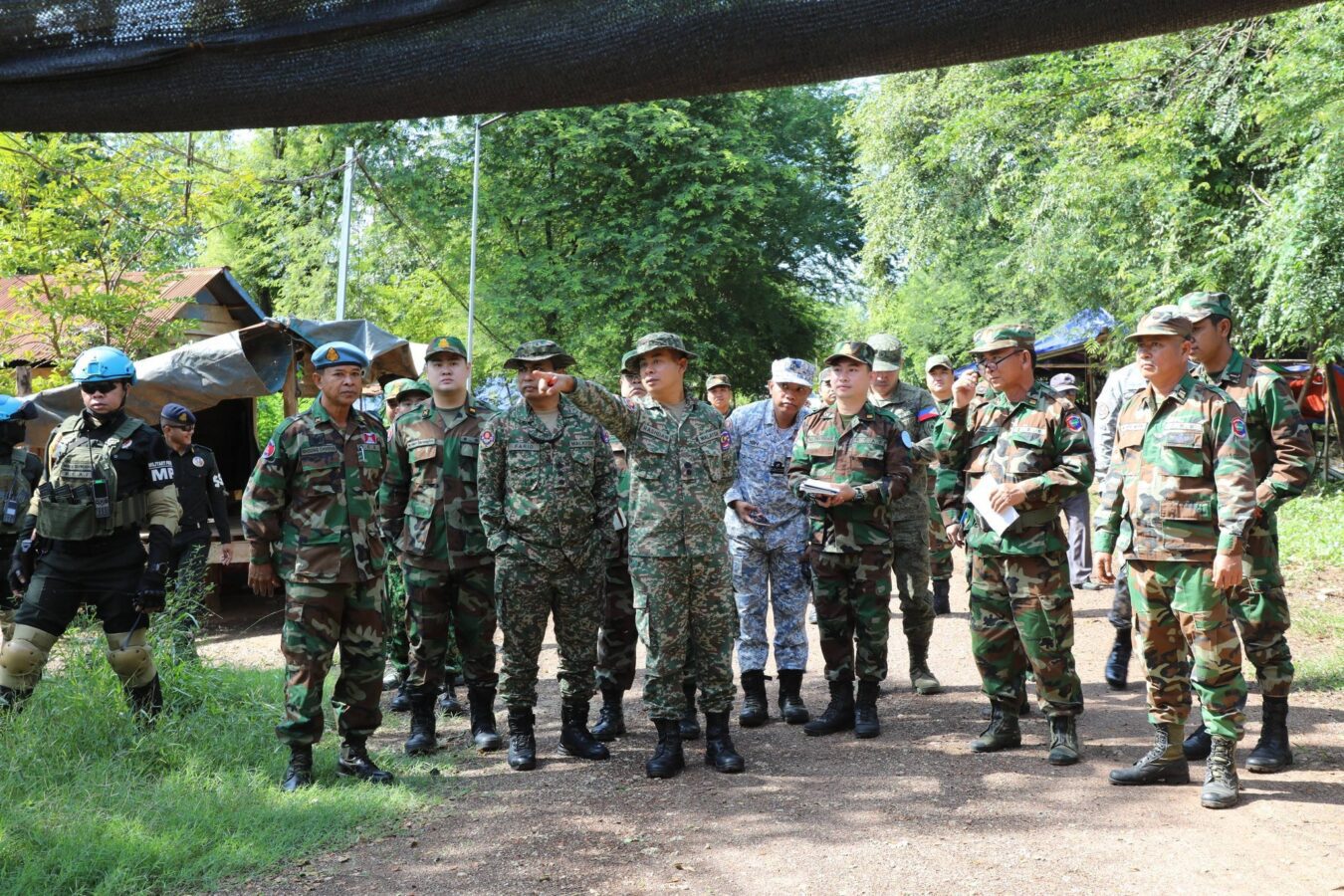 Cambodia’s National Defense Ministry on Monday facilitated the Interim Observer Team’s visit to Chouk Chey village, O' Bei Choan Commune in Banteay Meanchey province where Thai authorities installed a banner to warn locals to leave or face Thai enforced laws. (A photo posted on Ministry’s Facebook)