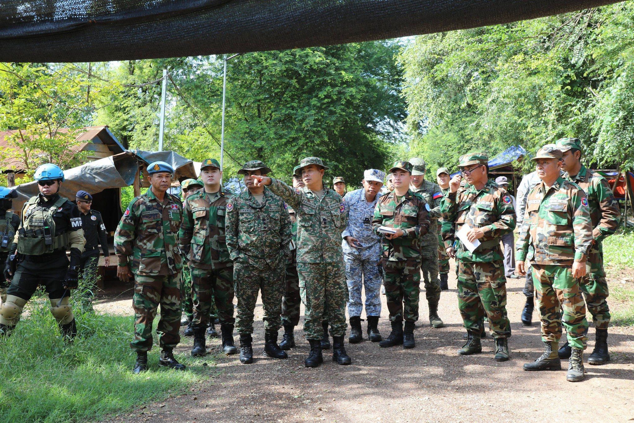 Cambodia’s National Defense Ministry on Monday facilitated the Interim Observer Team’s visit to Chouk Chey village, O' Bei Choan Commune in Banteay Meanchey province where Thai authorities installed a banner to warn locals to leave or face Thai enforced laws. (A photo posted on Ministry’s Facebook)