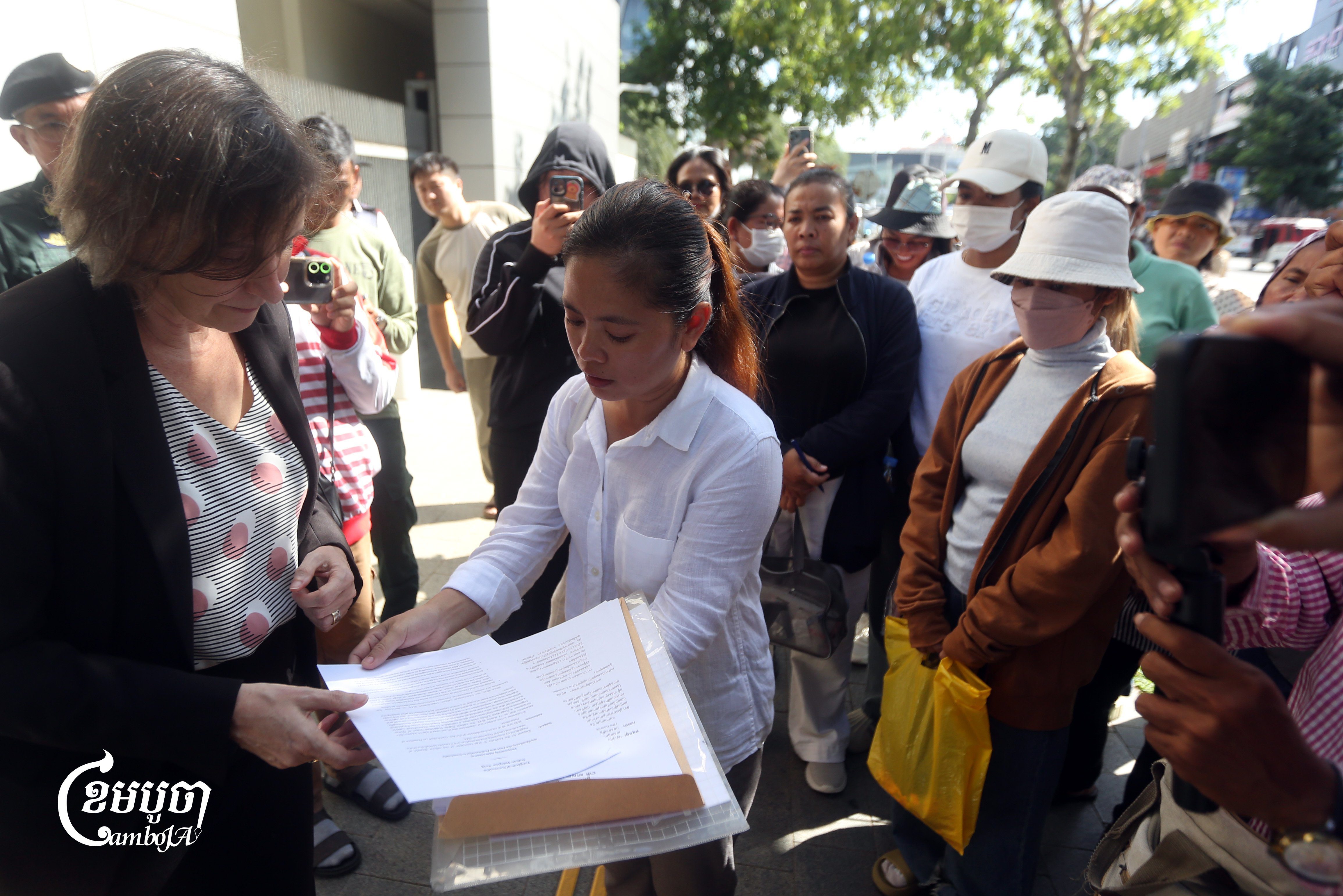 LRSU president Chhim Sithar and members submit a petition to the Australian Embassy in Phnom Penh, October 20, 2025. (CamboJA/Pring Samrang)