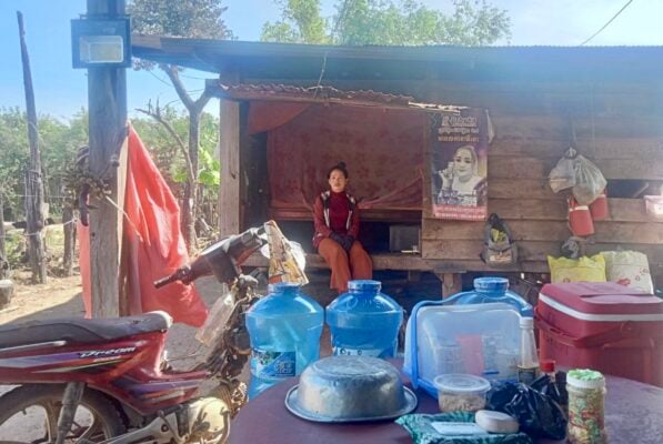 Chantha sits in a stilt family house in Oddar Meanchey. Nov. 24, 2025. (Supplied)