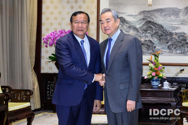 Chinese Foreign Minister Wang Yi shakes hands with Cambodian Foreign Minister Park Sokhonn during a meeting in November 2024. (Prak Sokhonn’s Facebook)