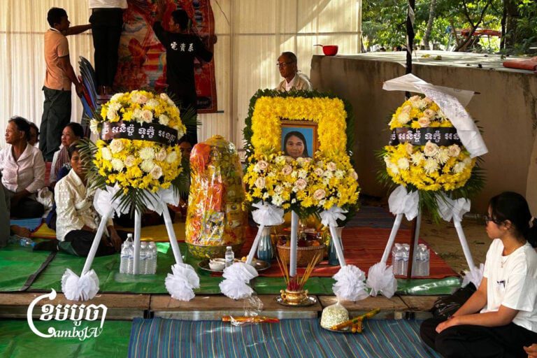 Chheng Ra, 62, from Preah Vihear’s Mom Bei area, was killed after shelling hit her home on Monday, her daughter Som Luda told CamboJA News during the funeral, saying the rounds came from the Thai side. Dec. 9, 2025. (CamboJA/Coby Hobbs)