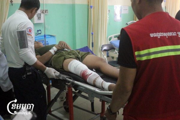 A wounded Cambodian soldier arrives at a hospital in Preah Vihear province after clashes with Thai forces. Dec. 9, 2025. (CamboJA/Coby Hobbs)